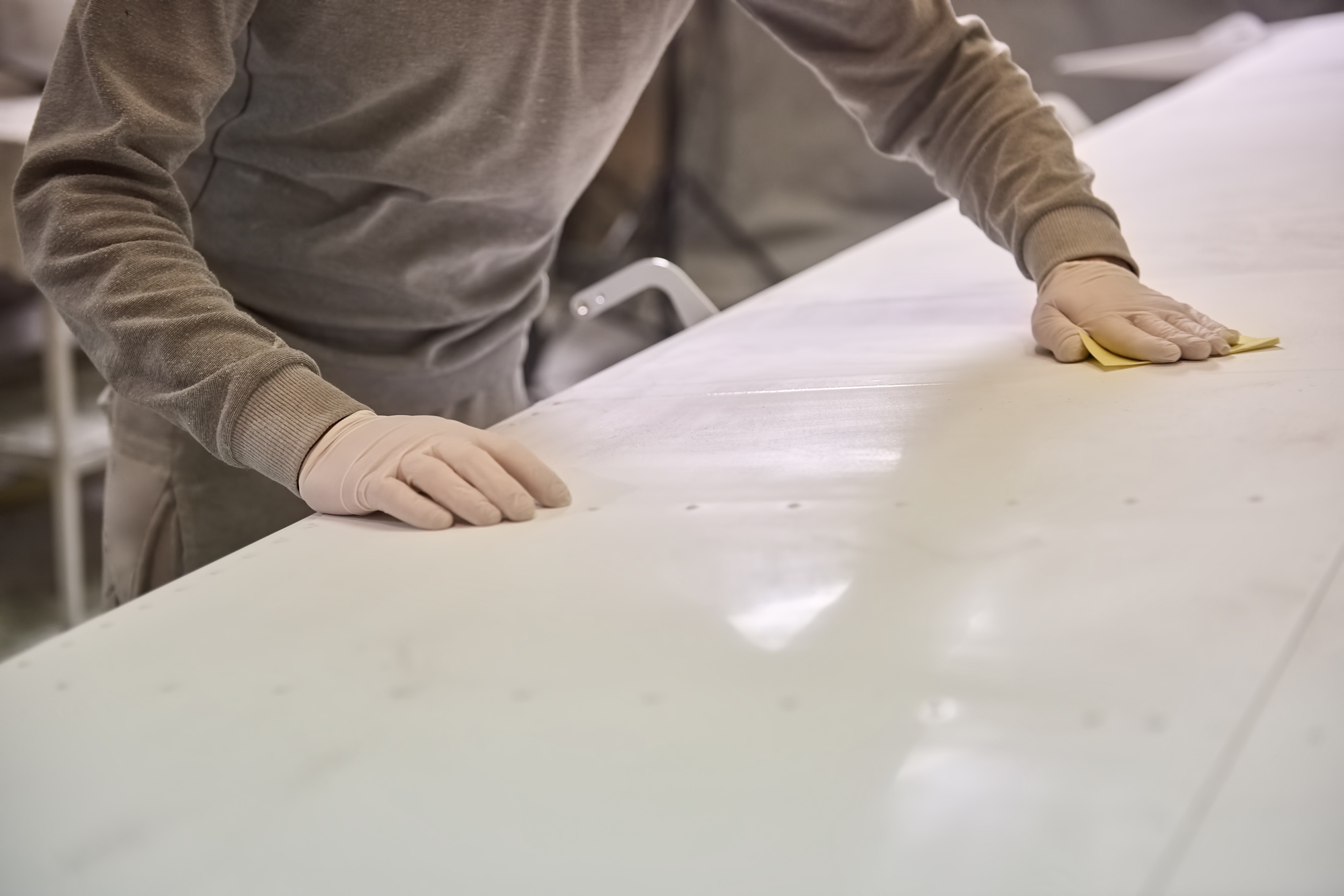 Man is cleaning white plate